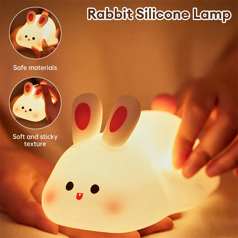 Squishy Bunny Night Light glowing in hands — soft, safe silicone
