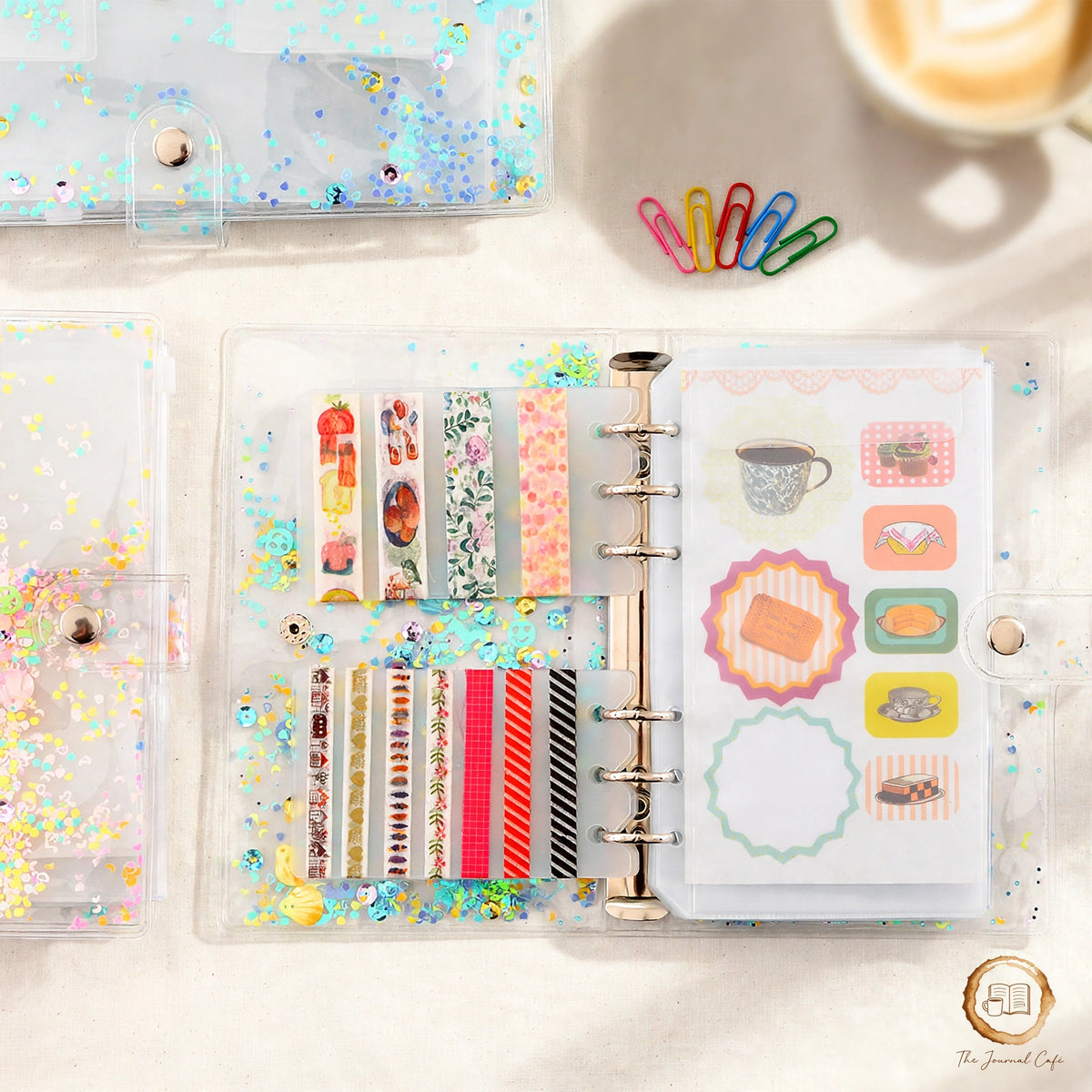 A5 sticker storage book — product photo 4 styled on a cream café table, The Journal Café