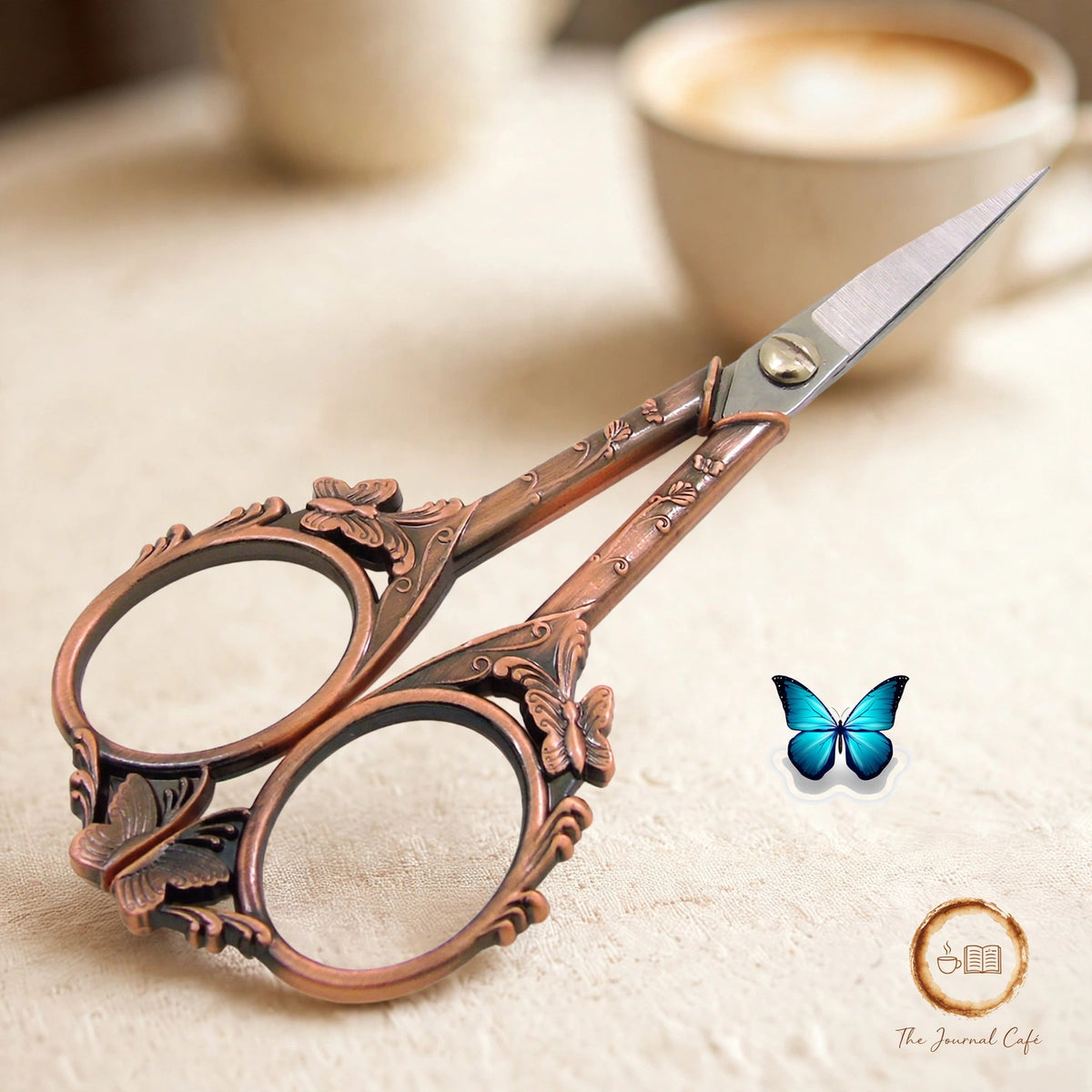 Butterfly retro scissors — product photo 4 styled on a cream café table, The Journal Café