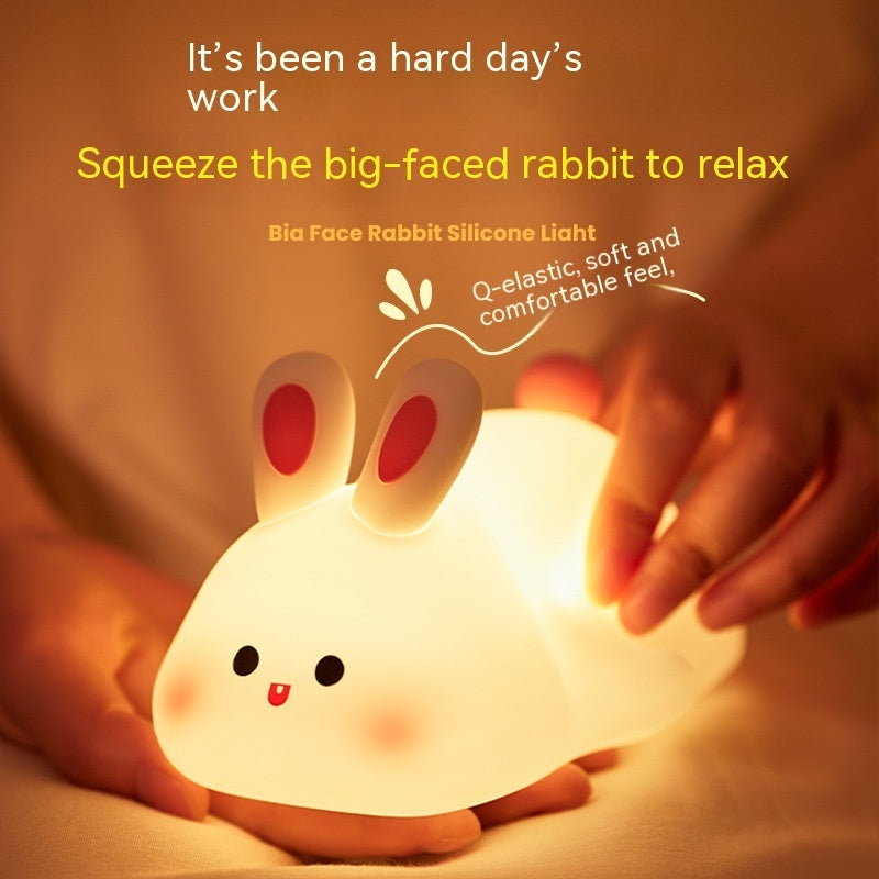 Squeezing the Squishy Bunny Night Light to relax