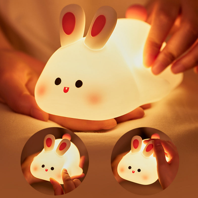 Squishy Bunny Night Light being squeezed — soft silicone