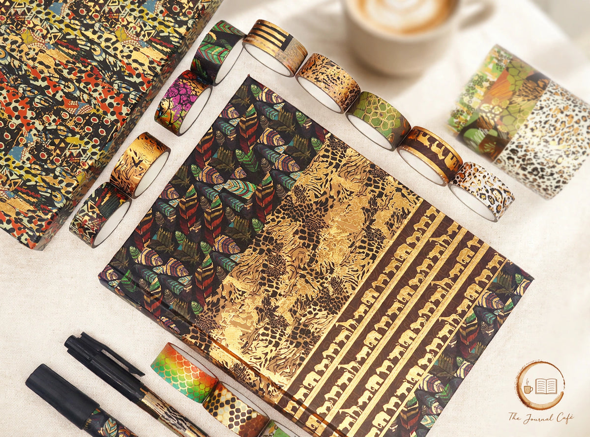 Animal Washi Tape Set — 12 rolls of animal-pattern washi tape styled on a cream café table, The Journal Café