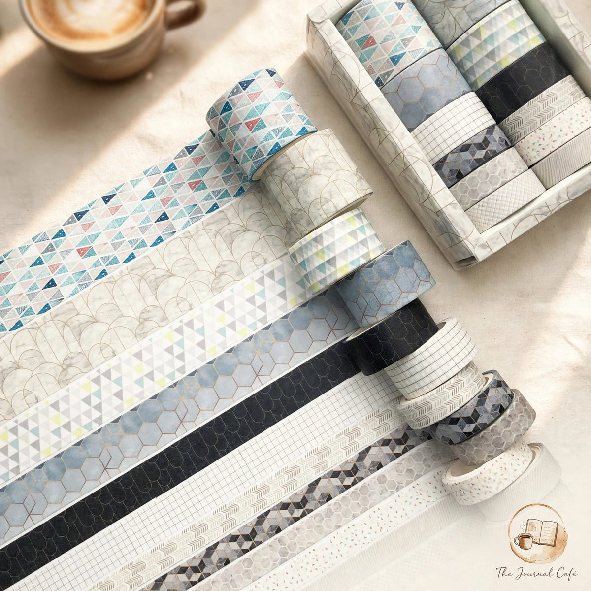 Antique Washi Tape Set — twelve boxed vintage-style rolls styled on a cream café table, The Journal Café