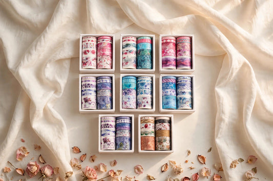 Slim Washi Tape Set — boxed rolls of floral Japanese paper washi tape in mixed widths on a cream café table, The Journal Café