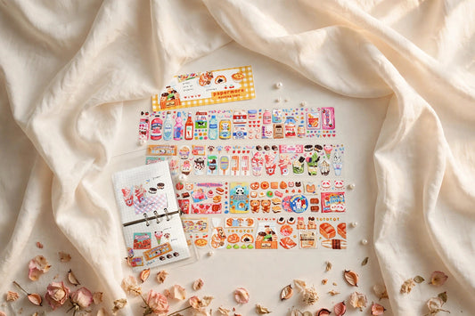 Sweet Store PET tape — wide glossy tape with cute bakery designs styled on a cream café table, The Journal Café