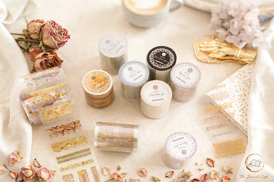 Lace PET Journal Tape — die-cut lace tape rolls in 4 designs styled on a cream café table, The Journal Café
