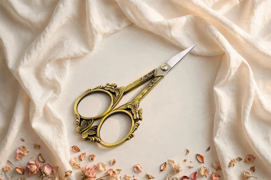 Butterfly cut retro scissors styled on a cream café table, The Journal Café