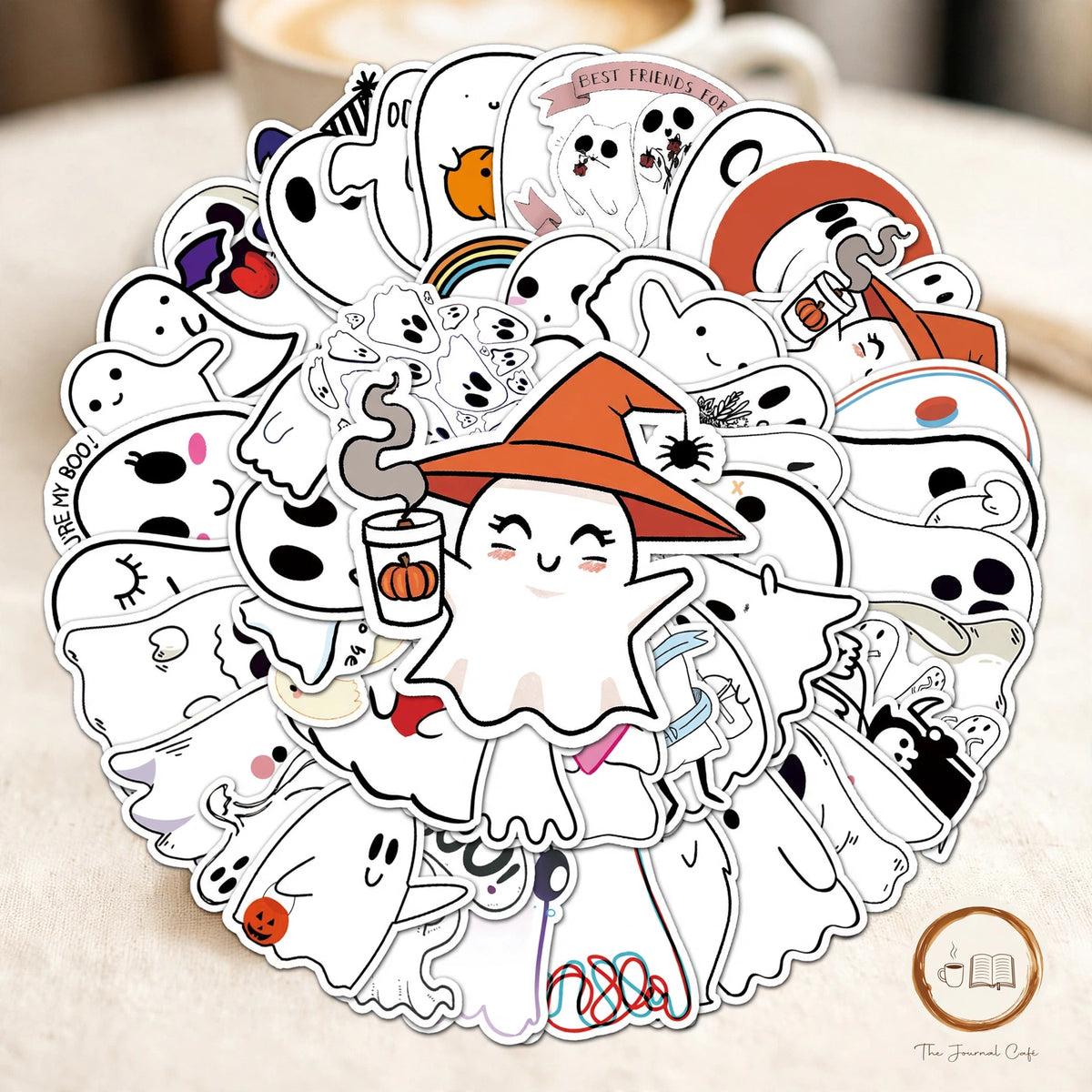 Cute Halloween Ghost Stickers — 50 cartoon ghost stickers styled on a cream café table, The Journal Café