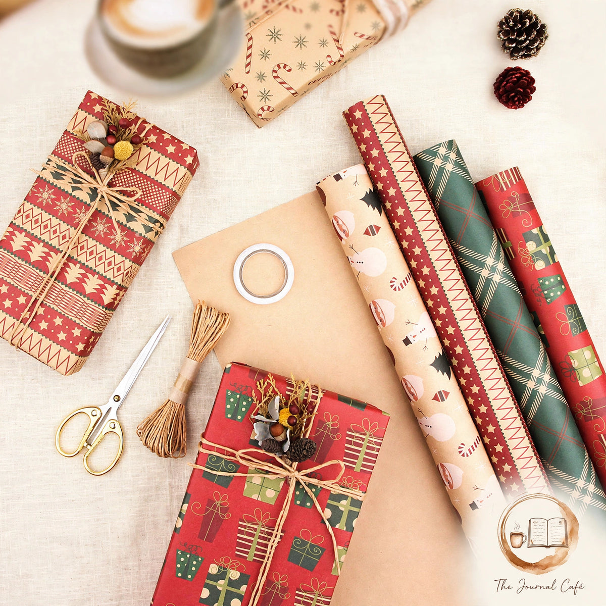 Vintage Christmas Kraft Wrapping Paper — rolls of red, green and cream festive wrap with wrapped gifts and twine styled on a cream café table, The Journal Café