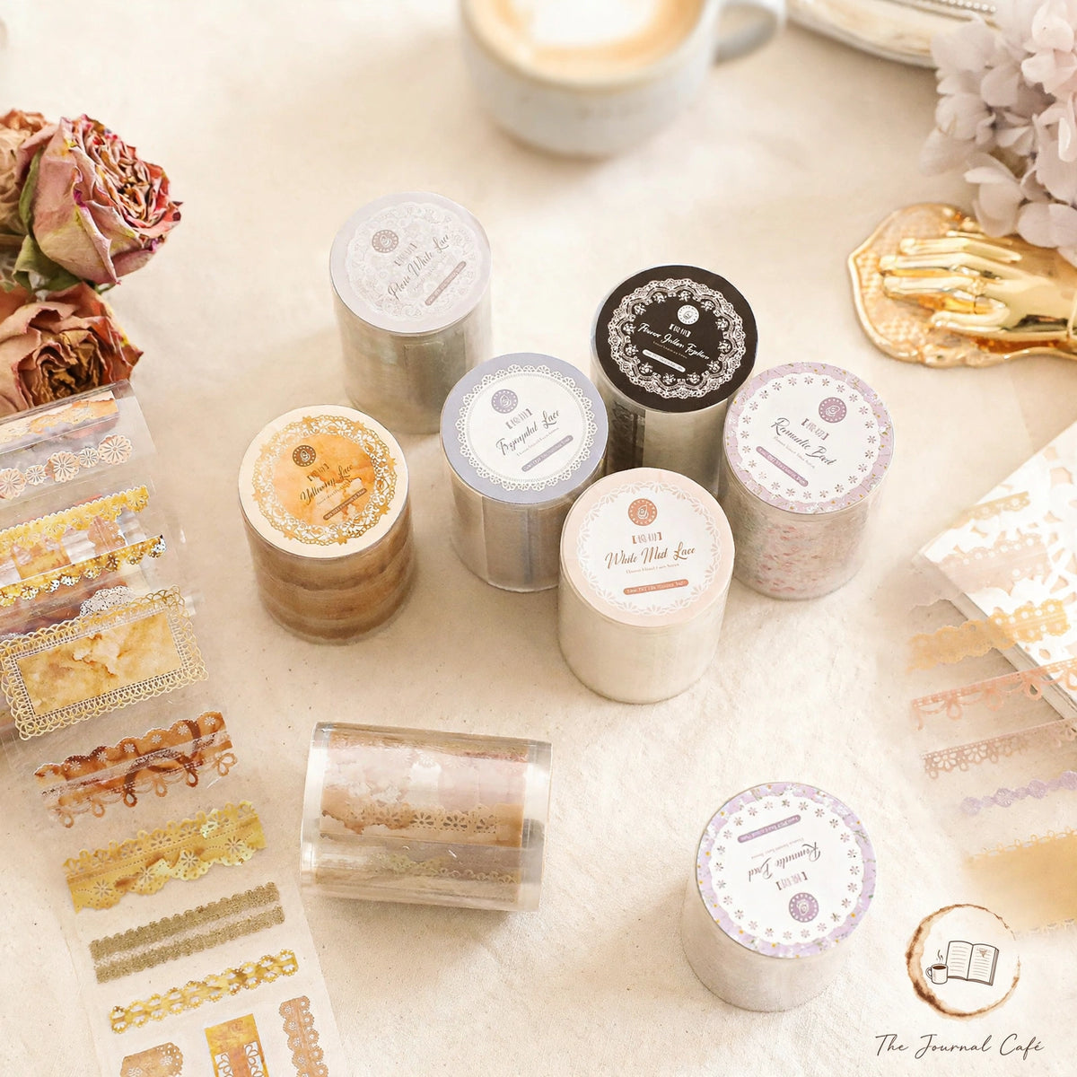Lace PET Journal Tape — die-cut lace tape rolls in 4 designs styled on a cream café table, The Journal Café