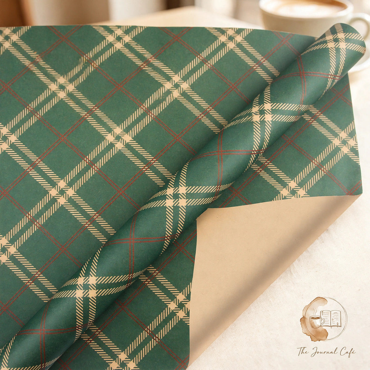 Vintage Christmas kraft wrapping paper — product photo 6 styled on a cream café table, The Journal Café
