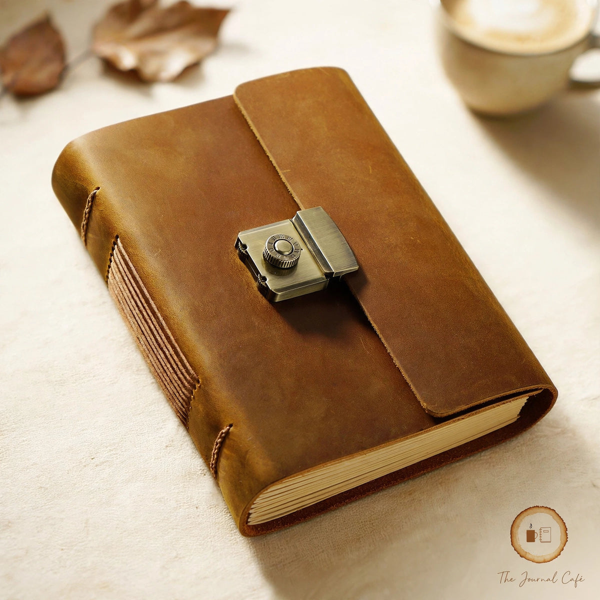 Vintage notebook — product photo 3 styled on a cream café table, The Journal Café