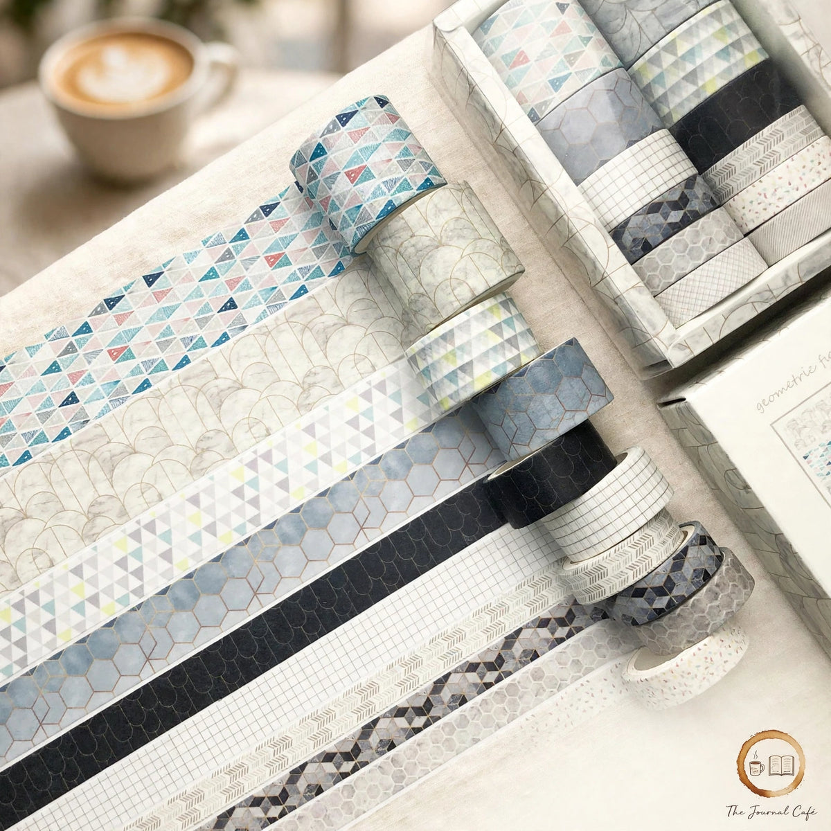 Antique washi tape set — product photo 2 styled on a cream café table, The Journal Café