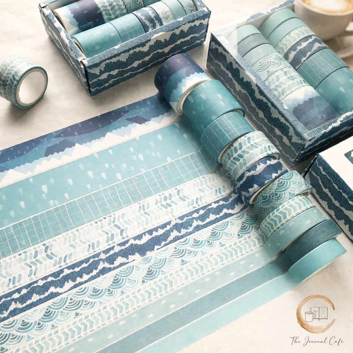 Antique washi tape set — product photo 4 styled on a cream café table, The Journal Café
