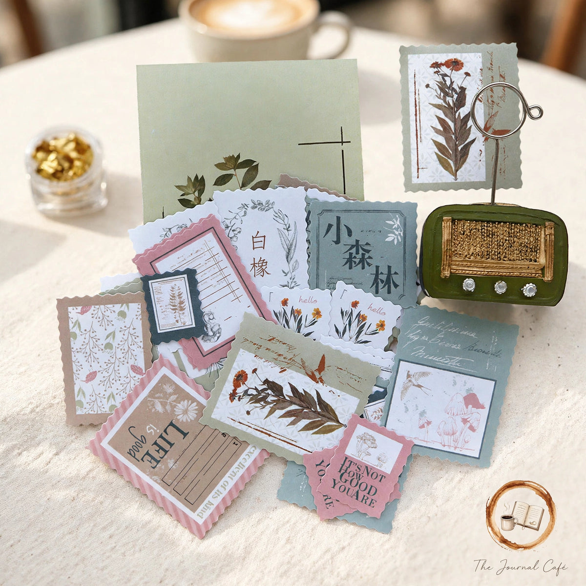 Vintage stamp sealing stickers — product photo 6 styled on a cream café table, The Journal Café