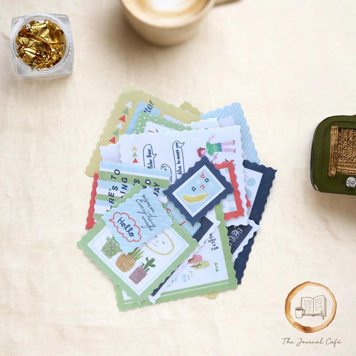 Vintage stamp sealing stickers — product photo 8 styled on a cream café table, The Journal Café