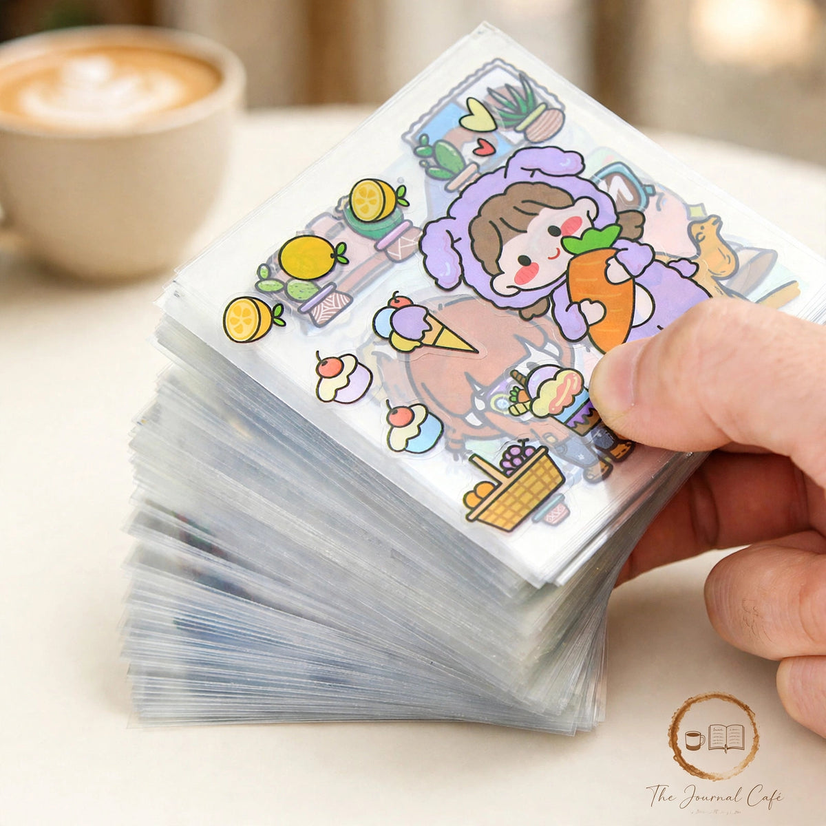 PET journal stickers — product photo 2 styled on a cream café table, The Journal Café