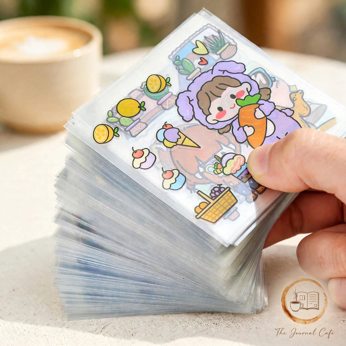 PET journal stickers — product photo 13 styled on a cream café table, The Journal Café