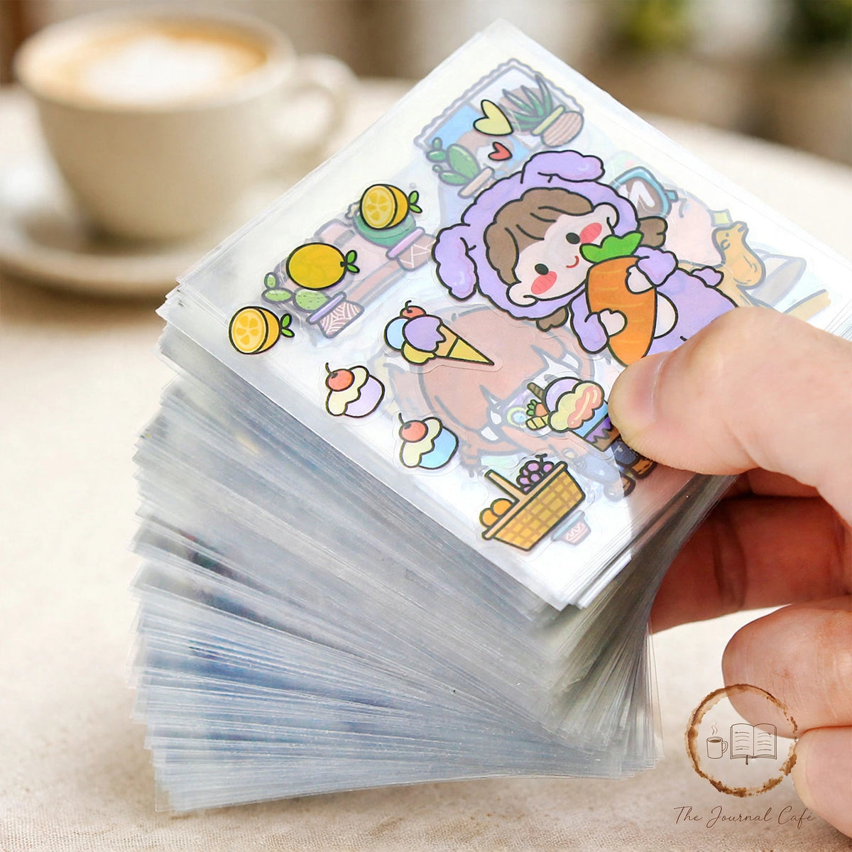 PET journal stickers — product photo 6 styled on a cream café table, The Journal Café