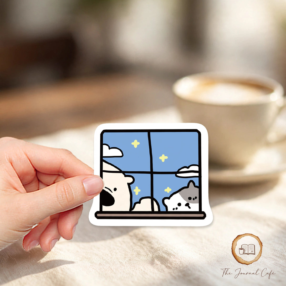 Cartoon animal hotel stickers — product photo 5 styled on a cream café table, The Journal Café