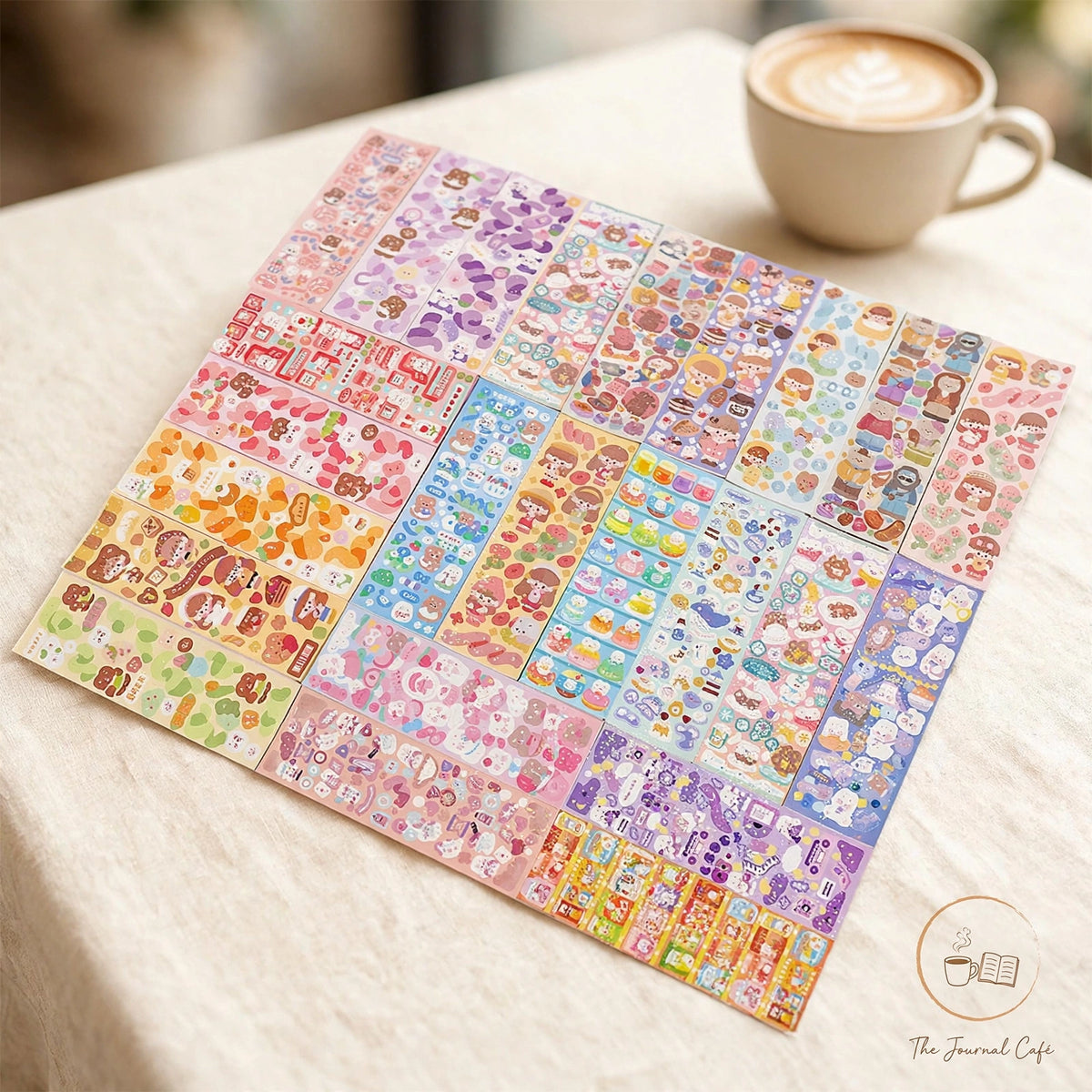 Holographic laser sticker sheets — product photo 12 styled on a cream café table, The Journal Café