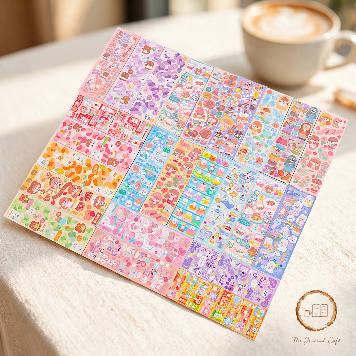Holographic laser sticker sheets — product photo 9 styled on a cream café table, The Journal Café