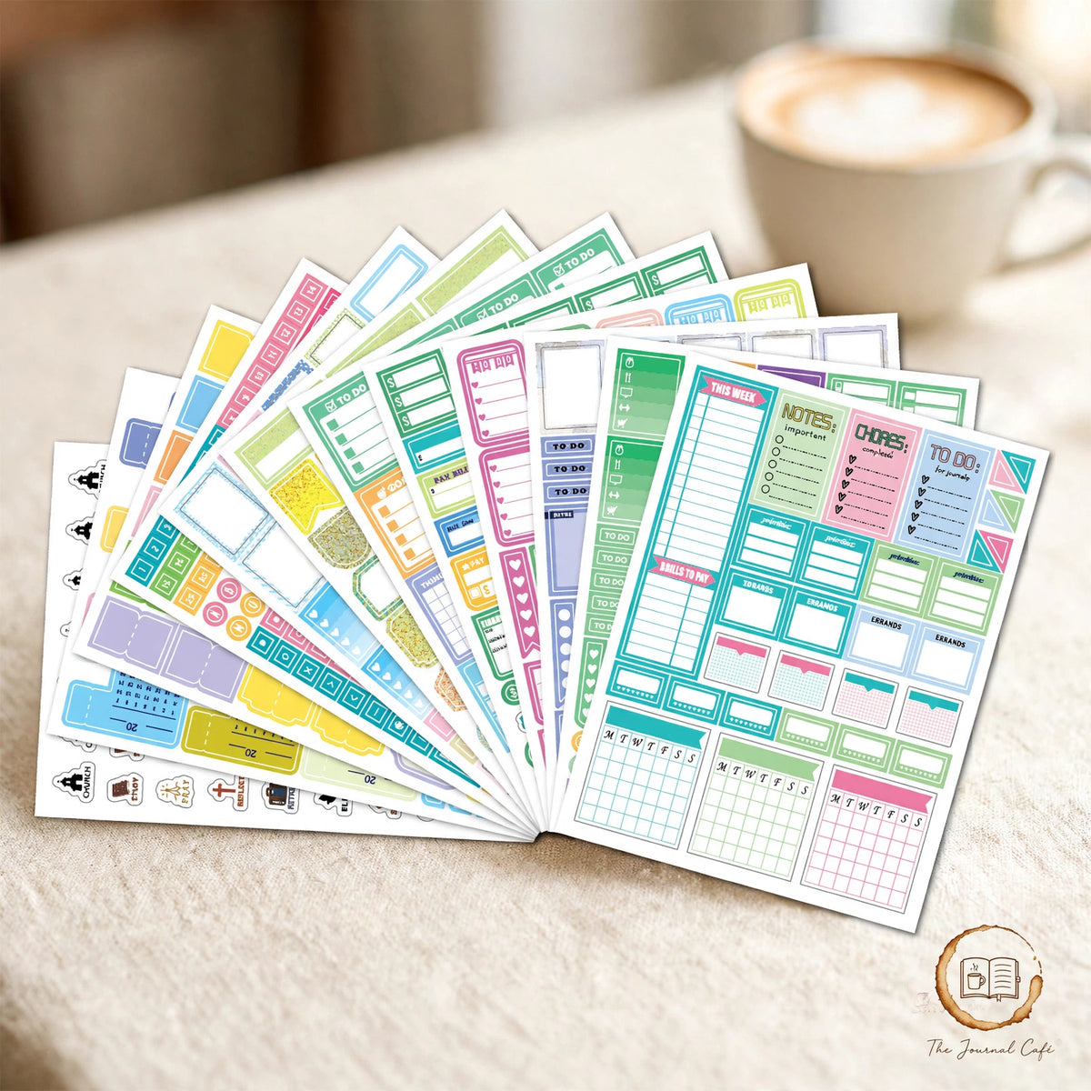 Seasonal monthly planner stickers — product photo 6 styled on a cream café table, The Journal Café