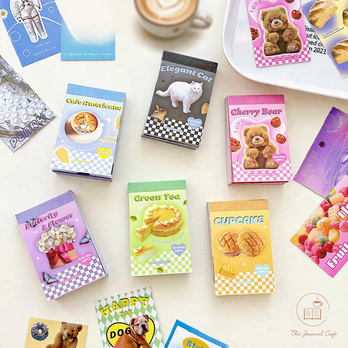 American retro mini sticker book — product photo 3 styled on a cream café table, The Journal Café