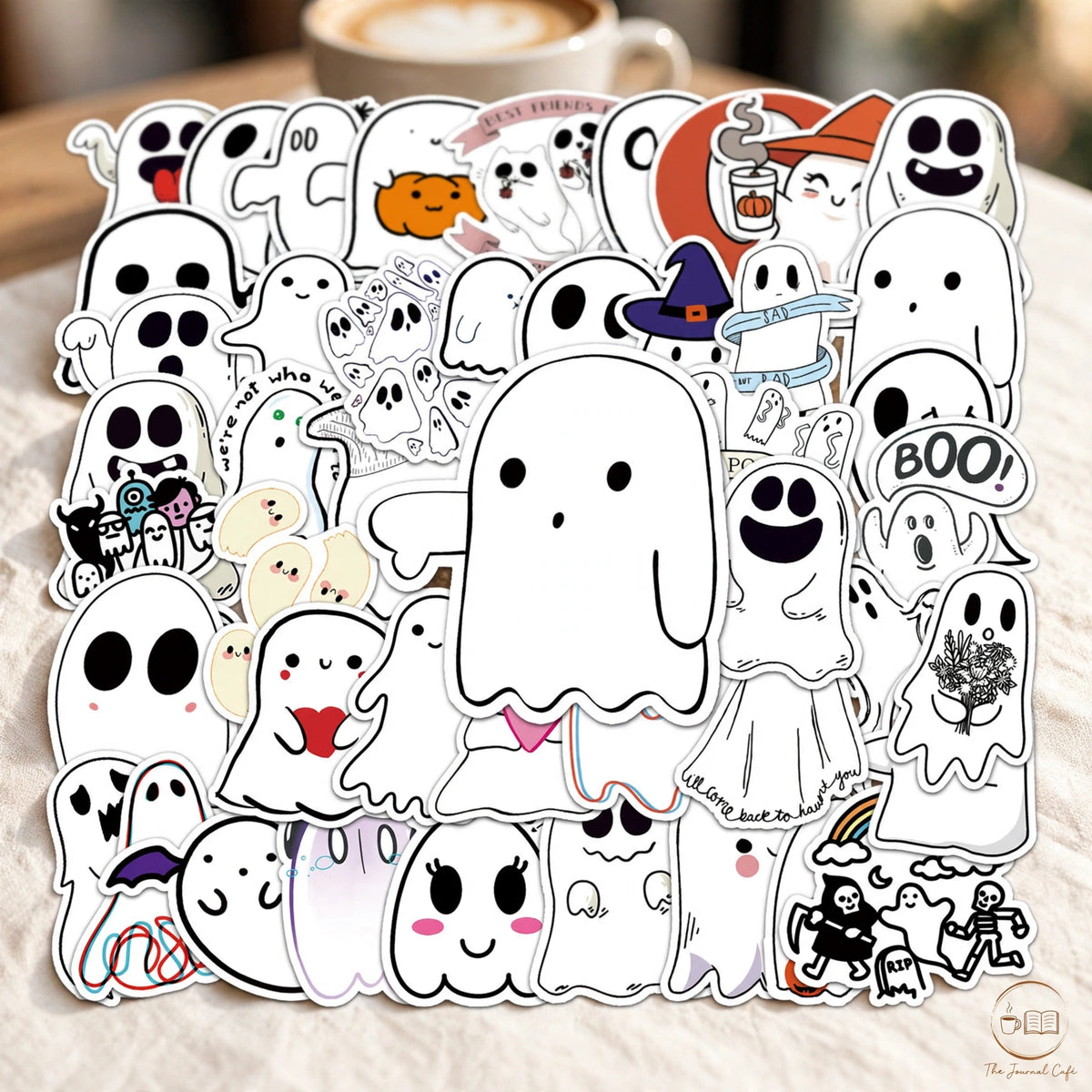 Cute Halloween ghost stickers — product photo 3 styled on a cream café table, The Journal Café