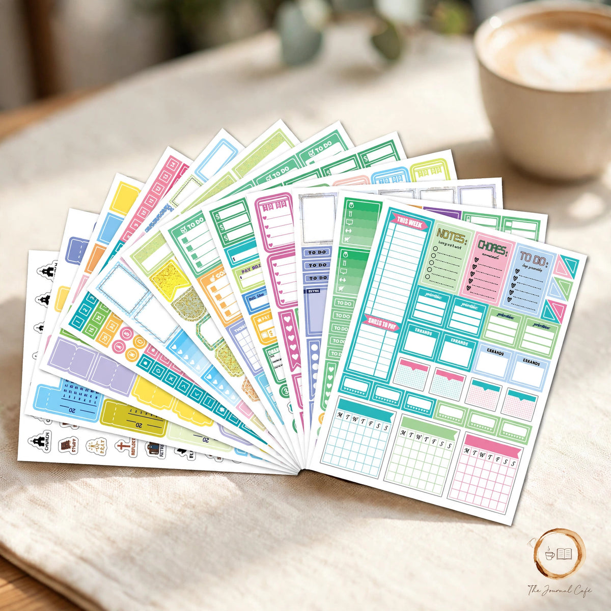 Monthly planner stickers 12 sheets — product photo 3 styled on a cream café table, The Journal Café