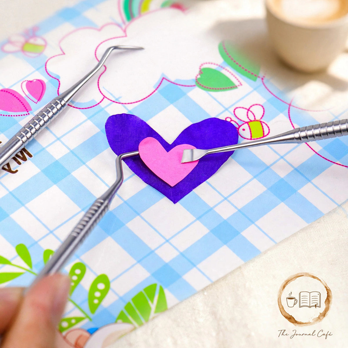 5-piece vinyl sticker tool set — product photo 2 styled on a cream café table, The Journal Café