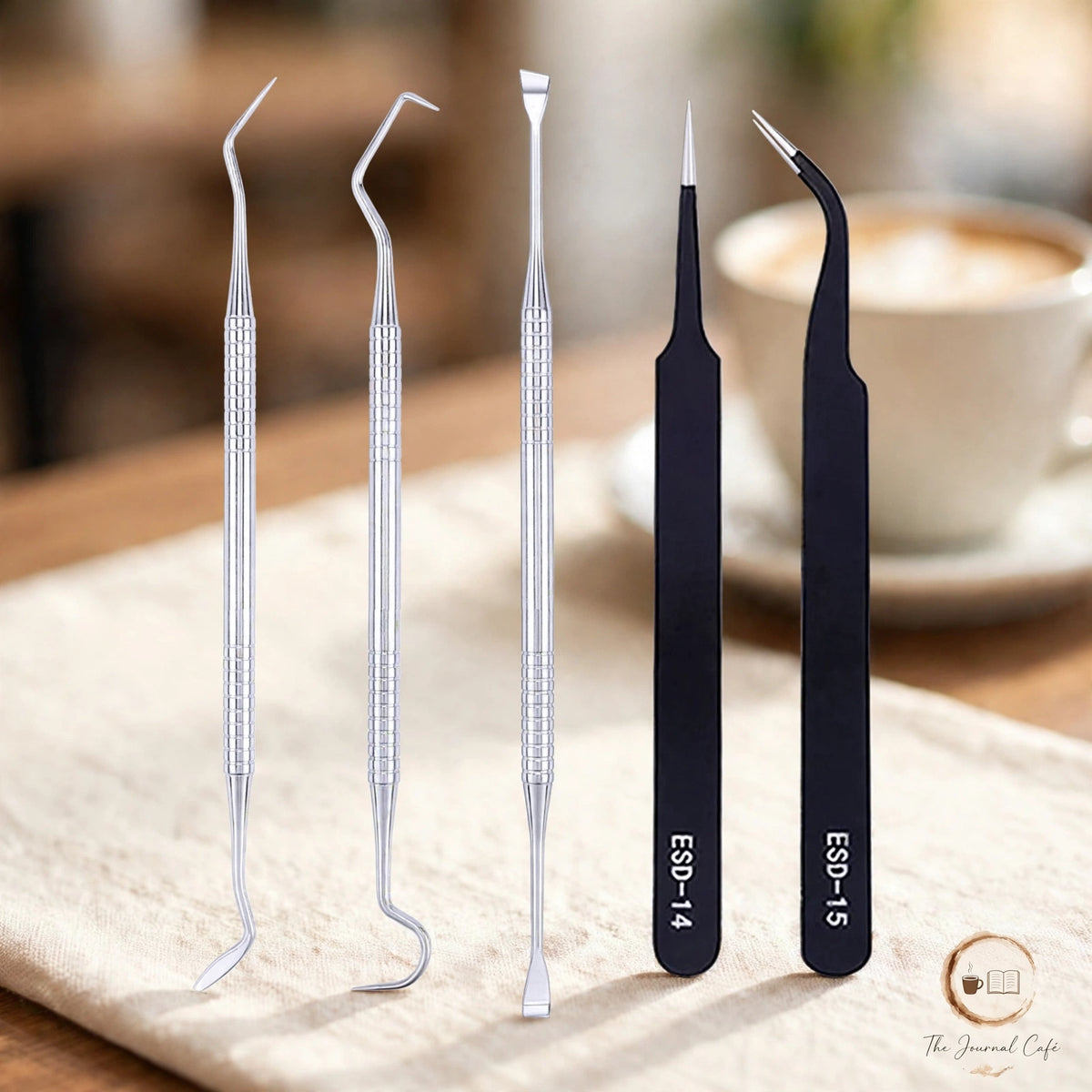 5-piece vinyl sticker tool set — product photo 5 styled on a cream café table, The Journal Café