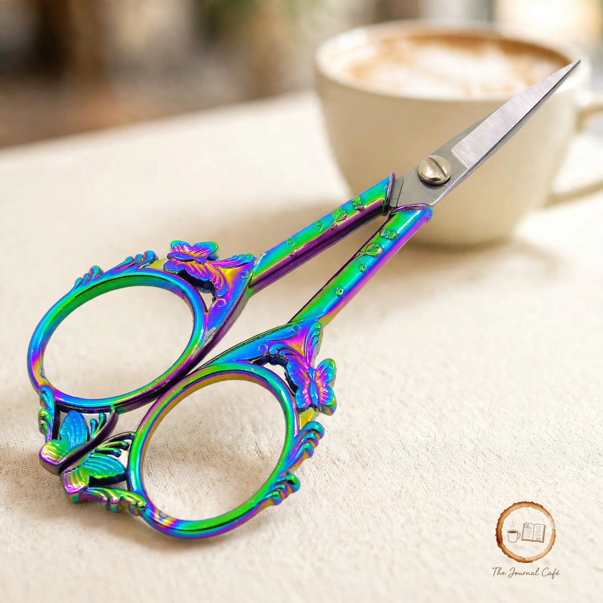 Butterfly retro scissors — product photo 7 styled on a cream café table, The Journal Café
