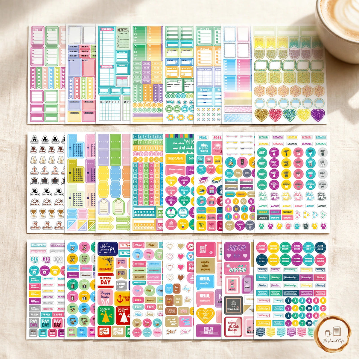 Seasonal monthly planner sticker set — 24 colorful sticker sheets on a cream café table, The Journal Café