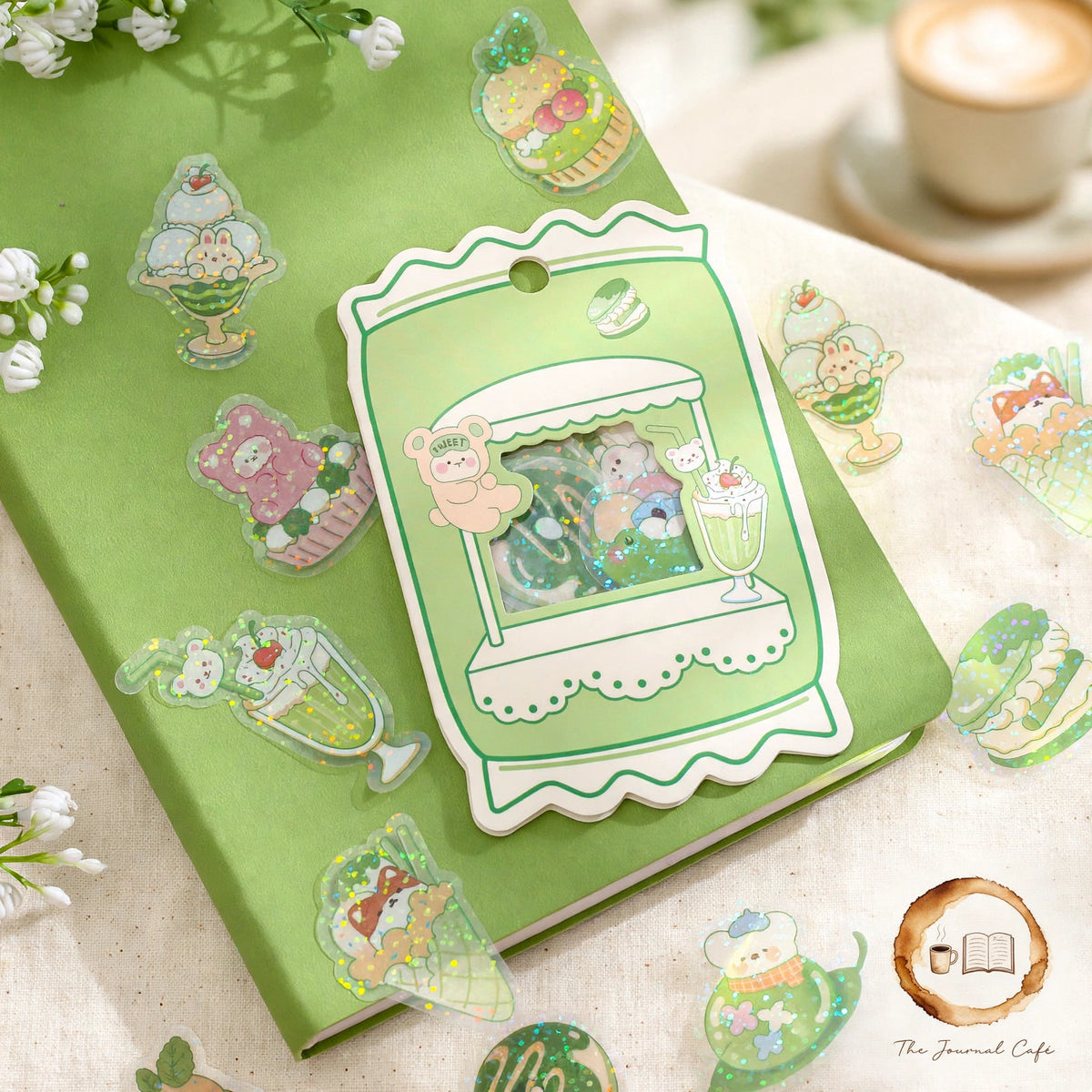 Sweetheart Convenience Store Sticker Pack — cute convenience-store stickers with a sparkly glitter finish styled on a cream café table, The Journal Café